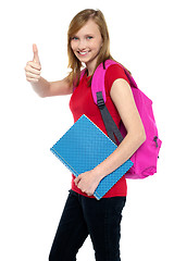 Image showing Pretty university student showing thumbs up sign