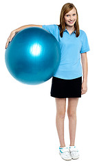 Image showing Slim and fit teen girl holding a swiss ball