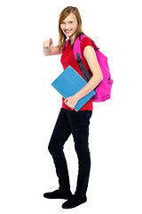 Image showing Trendy high school girl pointing at you