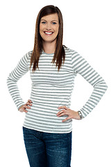 Image showing Trendy woman posing with hands on her waist