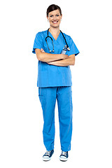 Image showing Smart looking female doctor, arms folded