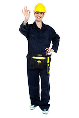 Image showing Female worker in jumpsuit showing perfect gesture