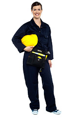 Image showing Relaxed construction worker with yellow helmet