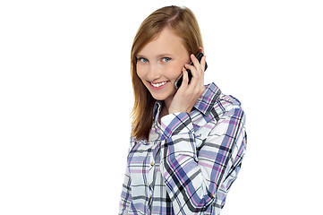 Image showing Pretty girl talking to her boyfriend on mobile