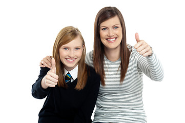 Image showing Charming daughter with her mother showing thumbs up sign