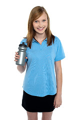 Image showing Teen in sports wear posing with a water bottle