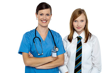 Image showing Confident medical expert posing with school girl