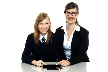 Image showing Tutor and student duo operating tablet pc