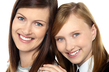 Image showing Closeup of mom and daughter flashing a smile