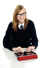 Image showing Student operating new touch screen tablet device