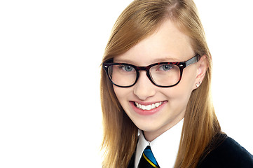 Image showing Closeup shot of smiling schoolgirl in eyeglasses