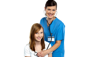 Image showing Young patient being examined by a cheerful doctor