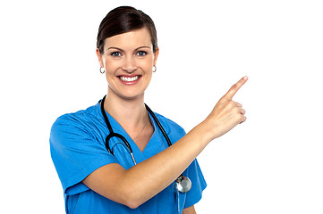 Image showing Doctor pointing away with her index finger