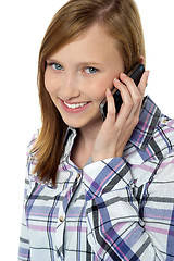 Image showing Close up of a pretty girl communicating on phone