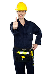 Image showing Confident lady worker showing thumbs up