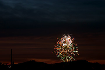 Image showing Firecrackers In The Sky During Sunset