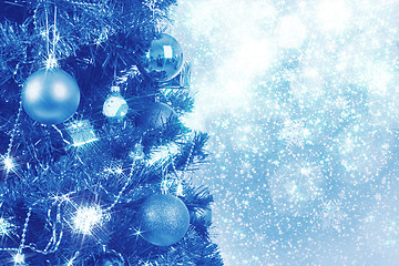 Image showing blue christmas background with balls on tree 