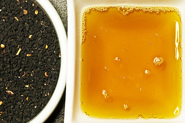 Image showing black cumin seeds and black cumin oil