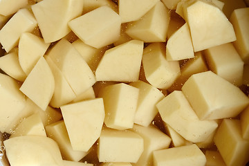 Image showing The diced potato tubers in water