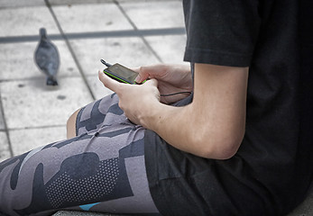 Image showing Young girl with mobile