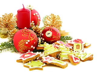 Image showing Christmas cookies, red balls and golden cones.