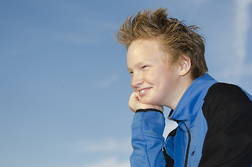 Image showing Portrait of youngster against blue sky