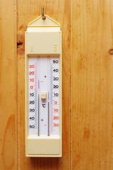 Image showing thermometer oa wooden wall