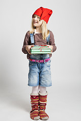 Image showing Smiling girl holding Christmas gifts