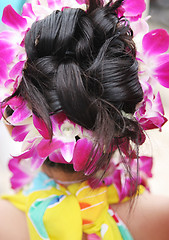 Image showing Tropical girl with fancy hairstyle