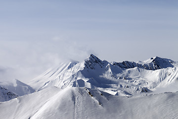 Image showing Snowy mountains in fog