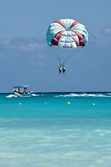 Image showing Couple flys on a parachute 