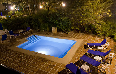 Image showing Beautiful pool and patio in tropical setting 