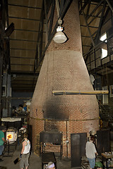 Image showing Glass furnace. Glass Blower at Work