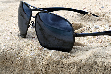 Image showing Sunglasses on a sand