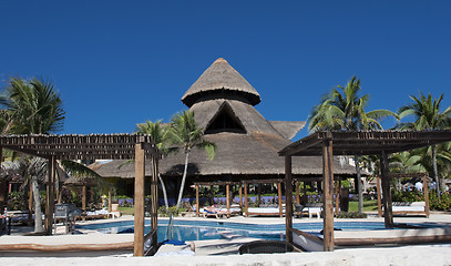 Image showing Resort pool side with plank bed