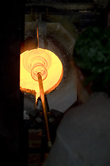 Image showing Glass furnace. Glass Blower at Work