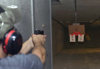 Image showing Target practicing with gun In the shooting range 