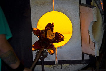 Image showing Glass furnace. Glass Blower at Work