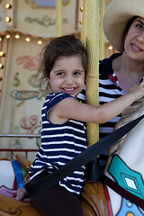 Image showing Mom and Daughter on merry-go-round