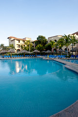 Image showing Beautiful pool and patio in tropical setting 