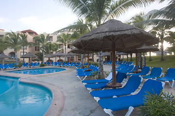 Image showing Beautiful pool and patio in tropical setting 