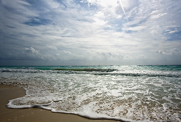 Image showing Golden shore hit by surf 