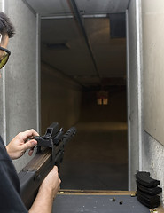 Image showing Target practicing with gun In the shooting range 