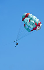 Image showing Couple flys on a parachute 