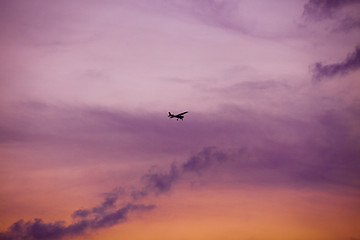 Image showing airplane flying at sunset