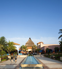 Image showing Beautiful pool and patio in tropical setting 