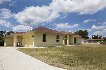 Image showing Luxury family house with landscaping on the front and blue sky o