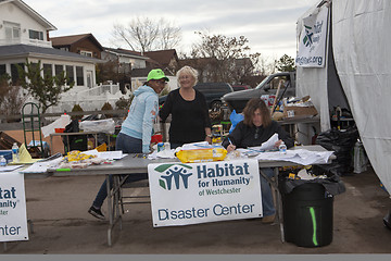 Image showing NEW YORK - November 12: Volunteers and workers helping people af