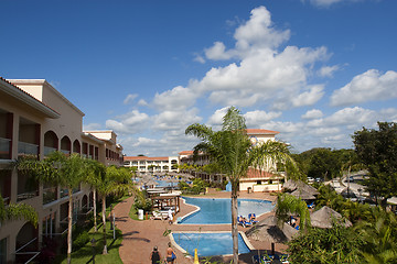 Image showing Beautiful pool and patio in tropical setting 