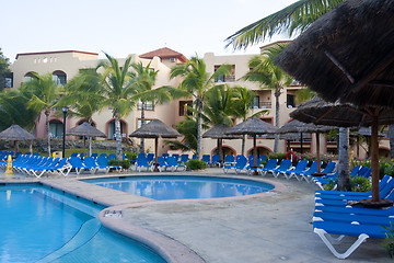 Image showing Beautiful pool and patio in tropical setting 